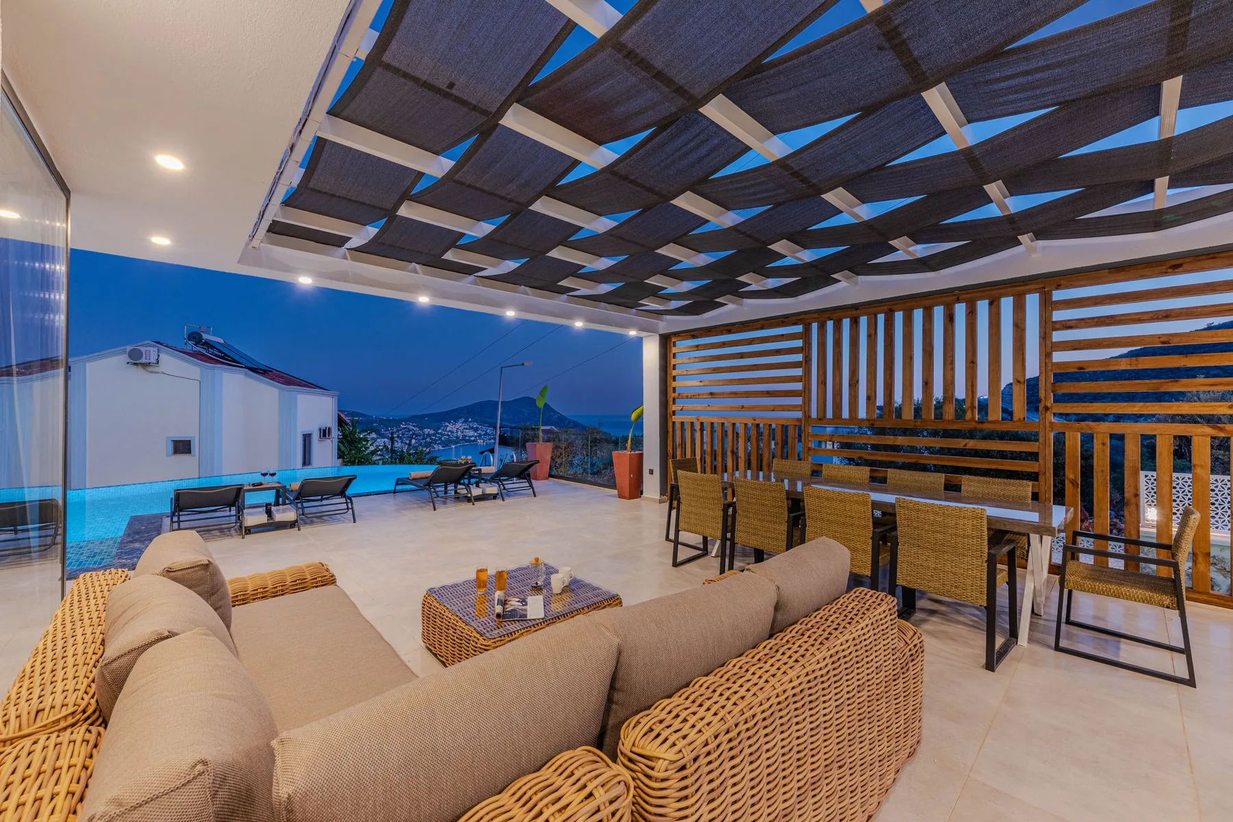 Covered pool patio with outdoor furniture that should be secured before a storm